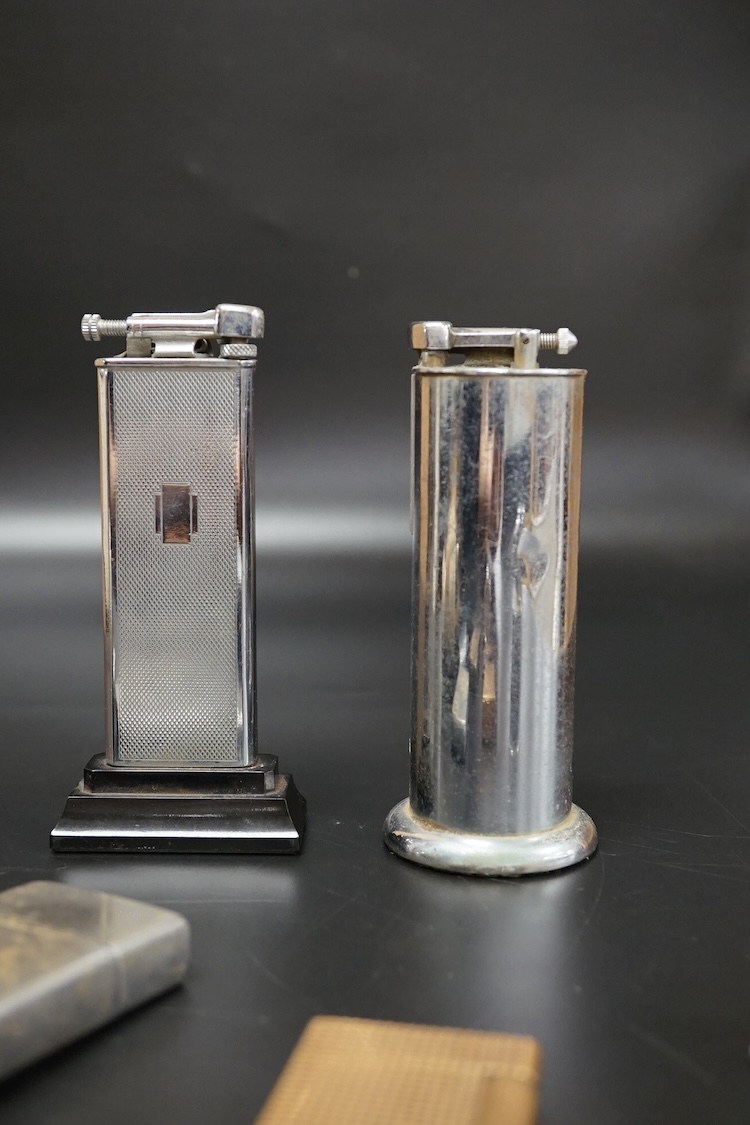 Ten assorted lighters including two Dunhill examples, a Ronson and Dupont, largest 12cm high